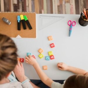 top view child tutor learning about numbers letters